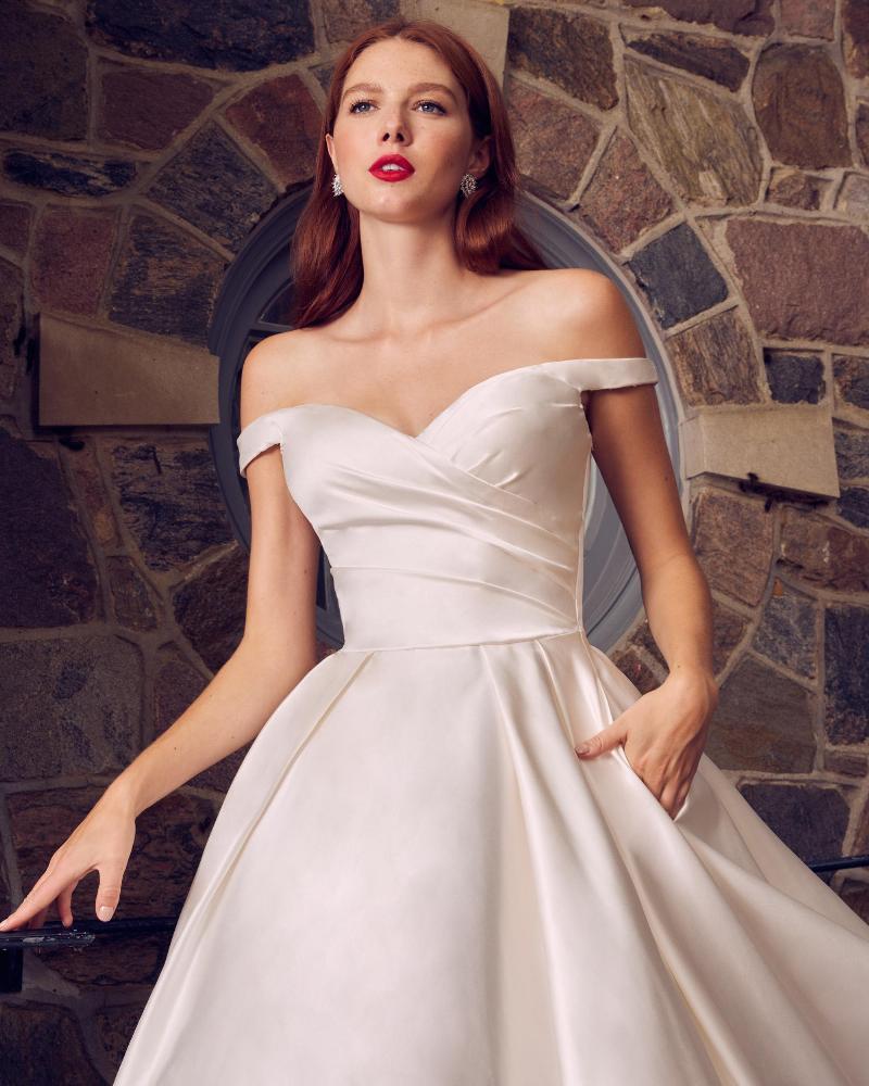 La22120 simple satin off the shoulder wedding dress with pockets and ball gown silhouette3